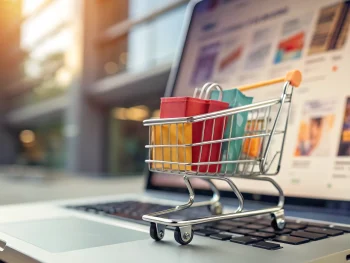 Primer plano de un brillante carrito de compras digital lleno de productos coloridos sobre una interfaz de tienda en línea borrosa, con un sutil motivo de flecha ascendente; la atmósfera transmite rapidez y eficiencia en el comercio electrónico. {{brizy_dc_image_alt entityId=