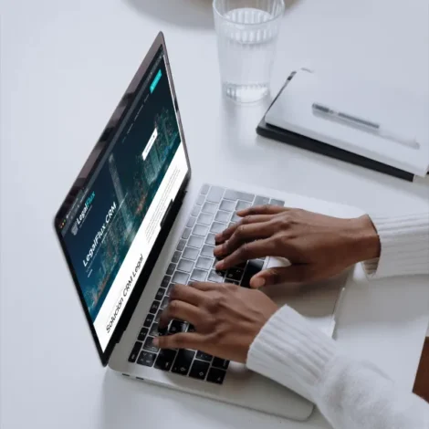 mockuuups-macbook-pro-mockup-on-a-white-table-with-glass-of-water-at-the-side
